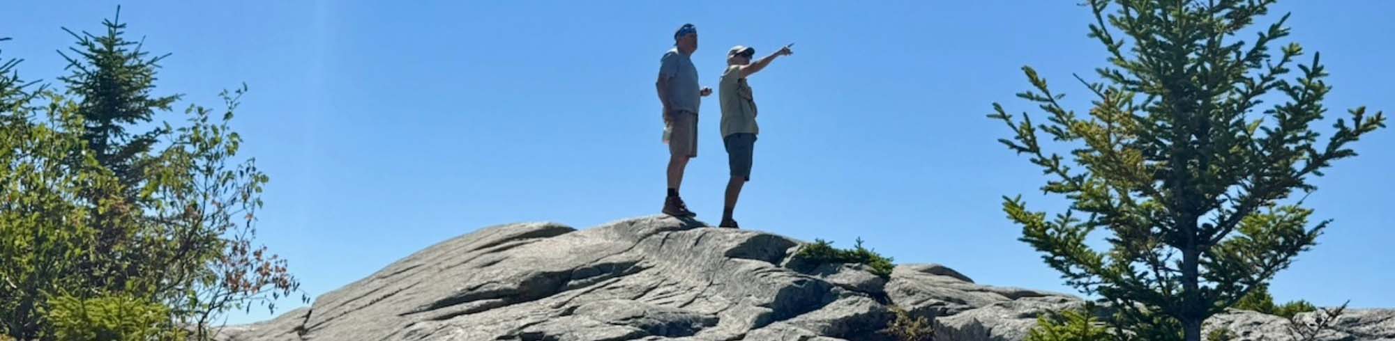 Two Hikers on Peak 2000×490